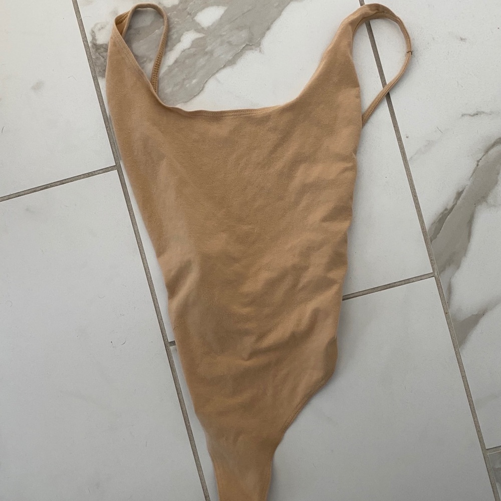 Tan body suit